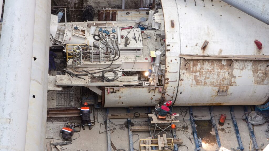 tunnel boring machine and workers

